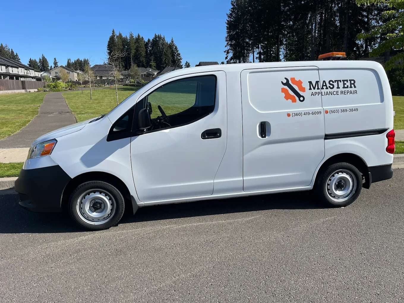Master Appliance branded service van in a Vancouver neighborhood